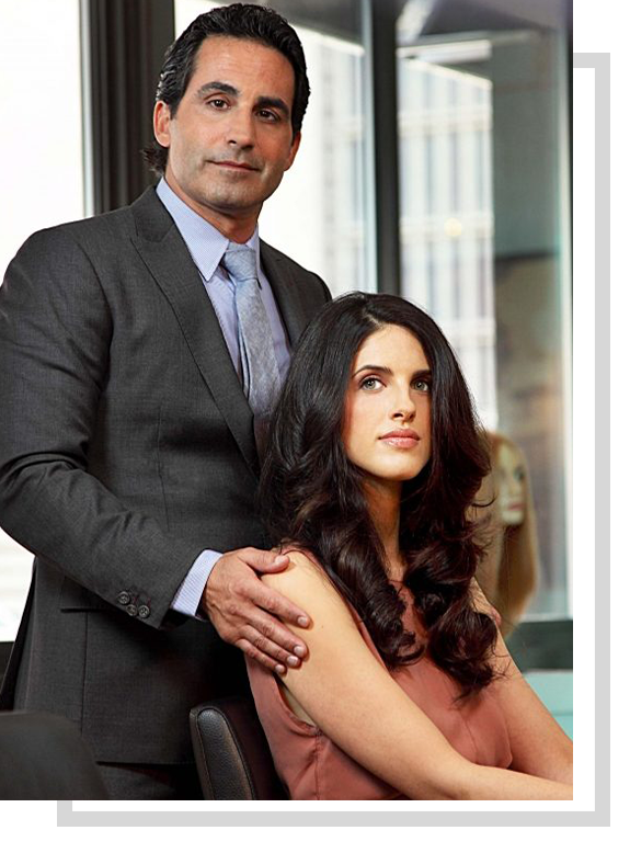 Angelo David with woman with long dark hair