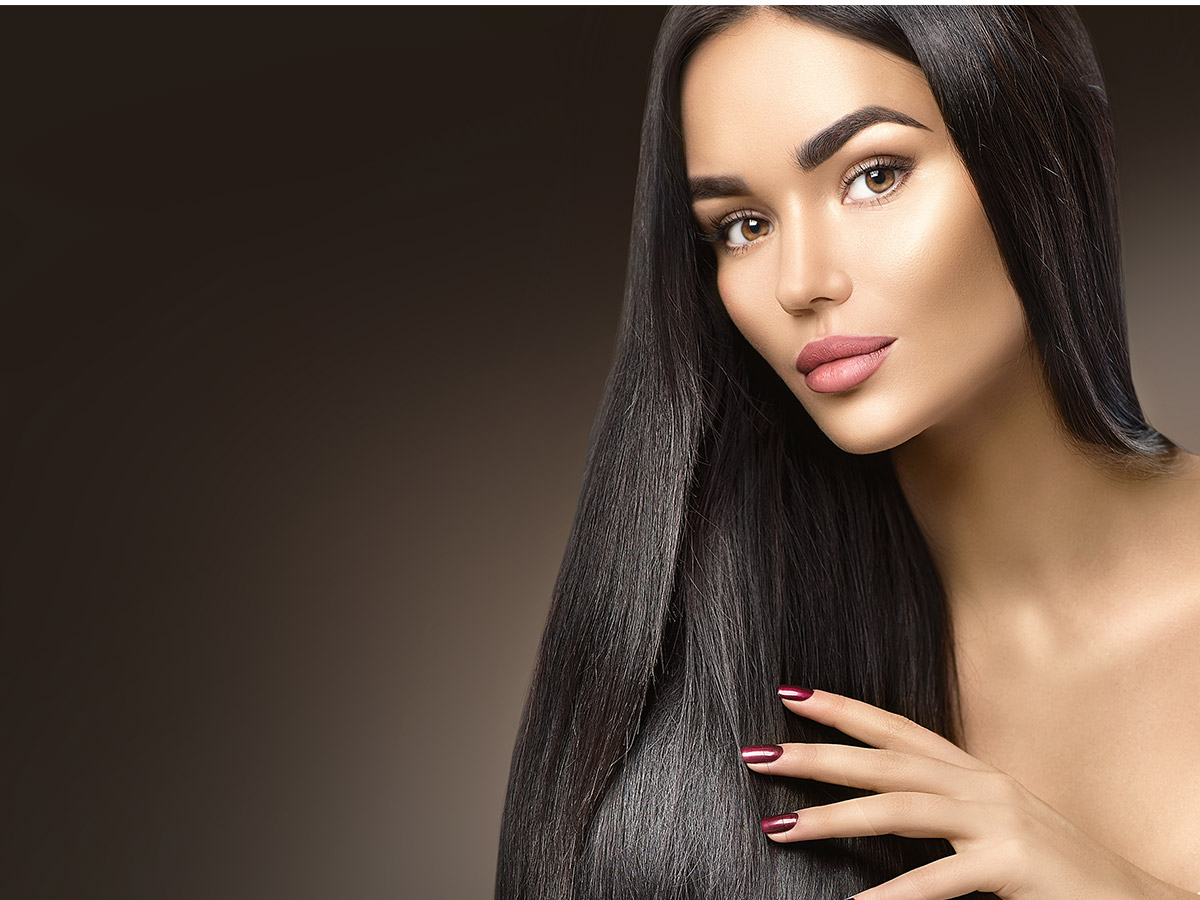 Woman with dark-chocolate-colored hair.