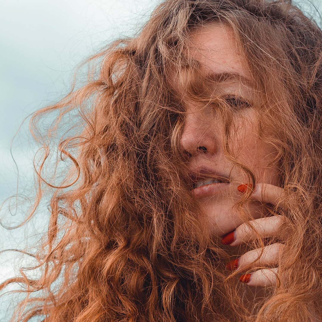 Woman with red curly hair